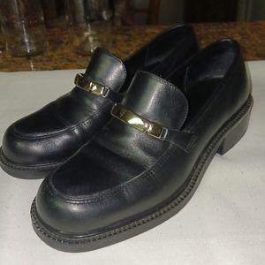 Black loafers with silver bar embellishment.  Size 6